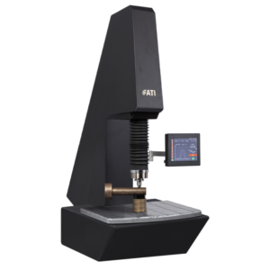 Modern hardness testing machine with digital display for precise material assessment.