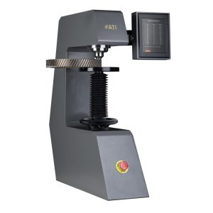 Hardness testing machine with digital screen, used in quality control and material testing processes.