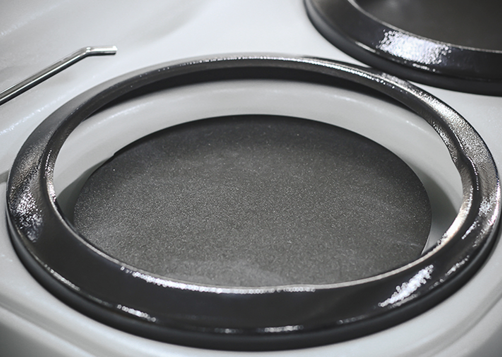 Close-up of a shiny black stovetop burner on a modern electric stove for kitchen appliances and cooking efficiency.